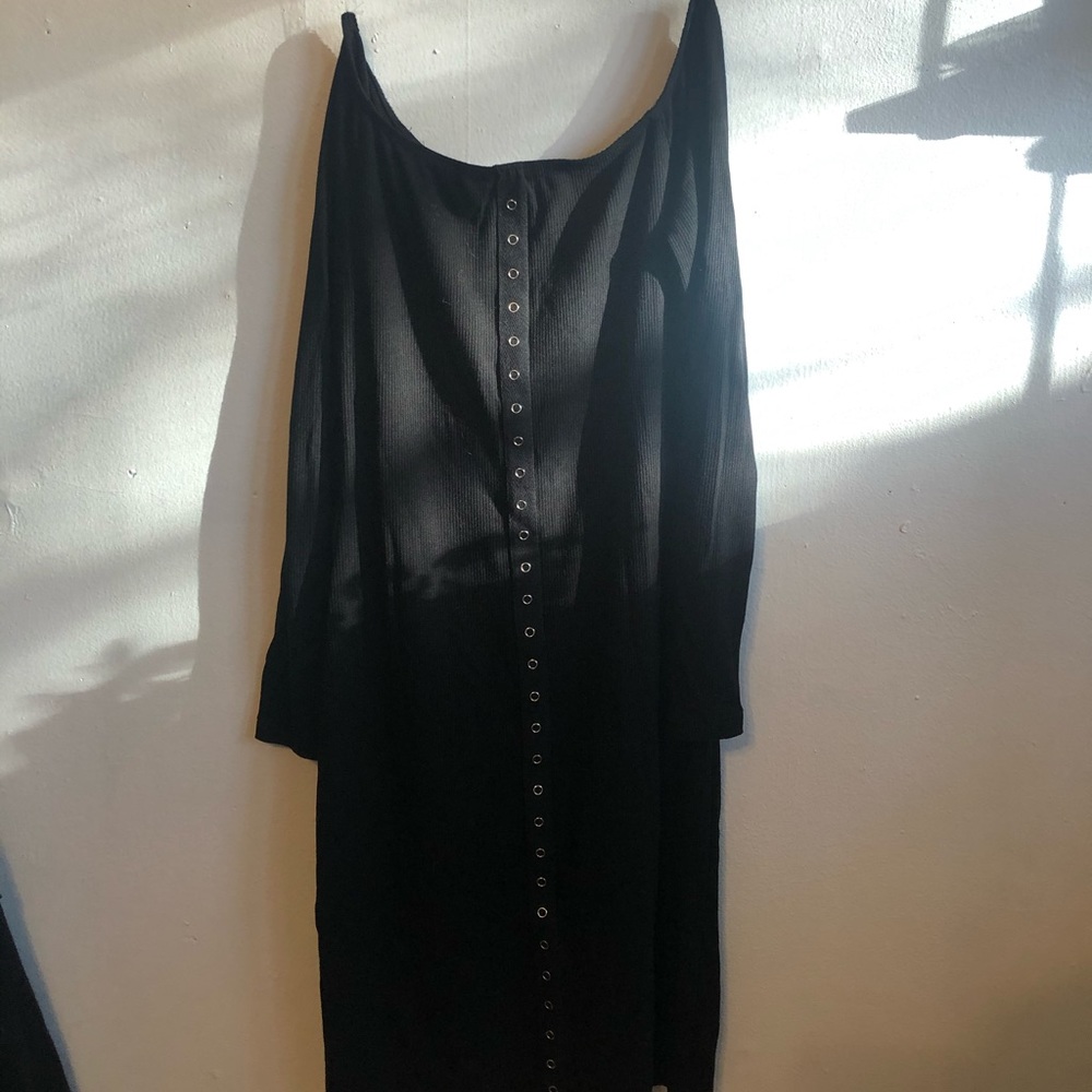 Off the shoulder Black fitted dress.